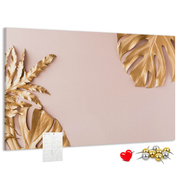 Prikbord met gouden bladeren op een delicate achtergrond