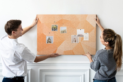 Prikbord met geometrische driehoeken in oranjetinten