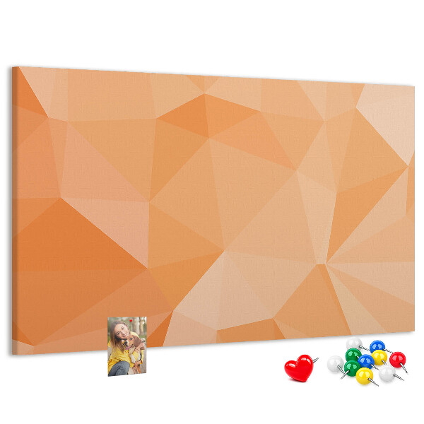 Prikbord met geometrische driehoeken in oranjetinten