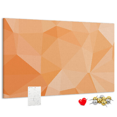 Prikbord met geometrische driehoeken in oranjetinten