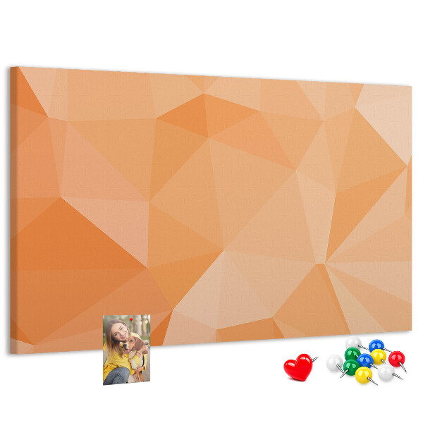 Prikbord met geometrische driehoeken in oranjetinten