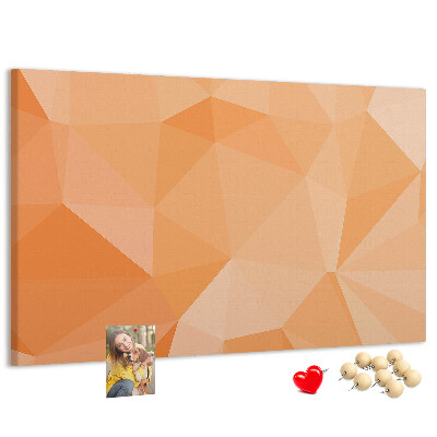 Prikbord met geometrische driehoeken in oranjetinten