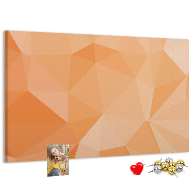 Prikbord met geometrische driehoeken in oranjetinten