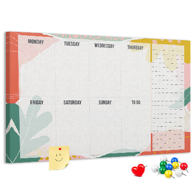 Kurkbord met bloemenkalender en kleurrijke accenten