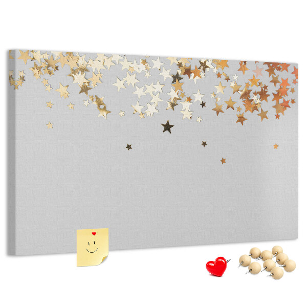 Kurkbord met gouden sterren op een grijze achtergrond