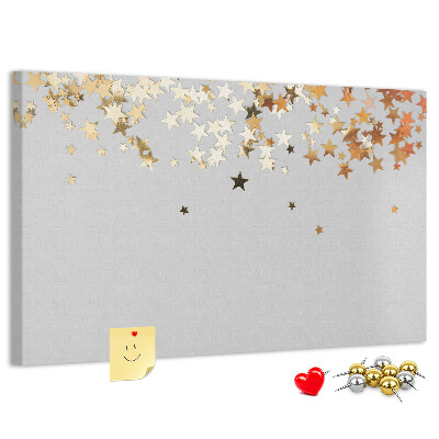 Kurkbord met gouden sterren op een grijze achtergrond