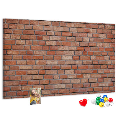 Prikbord met print van een bakstenen muur in warme tinten