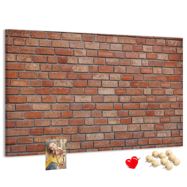 Prikbord met print van een bakstenen muur in warme tinten