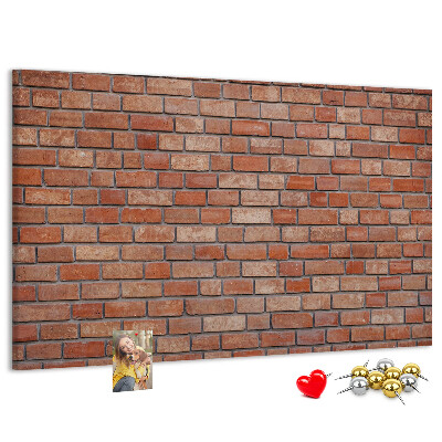 Prikbord met print van een bakstenen muur in warme tinten