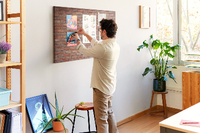 Prikbord met print van een bakstenen muur in warme tinten