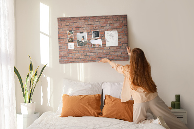 Prikbord met print van een bakstenen muur in warme tinten