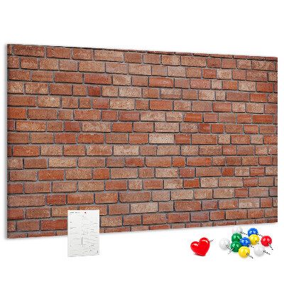 Prikbord met print van een bakstenen muur in warme tinten