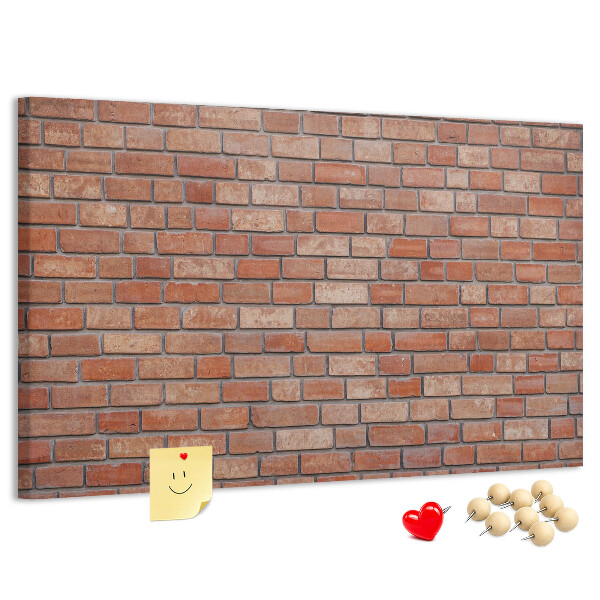 Prikbord met print van een bakstenen muur in warme tinten