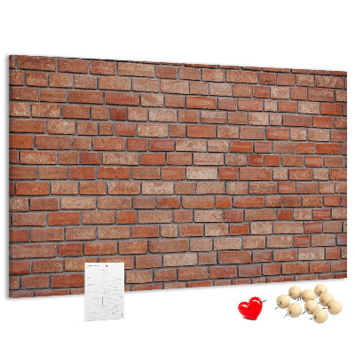 Prikbord met print van een bakstenen muur in warme tinten