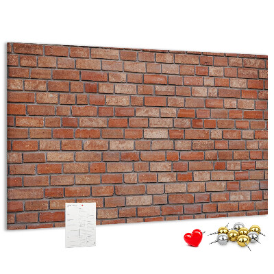 Prikbord met print van een bakstenen muur in warme tinten