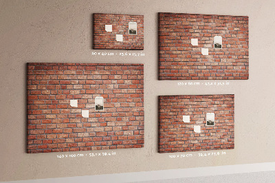 Prikbord met print van een bakstenen muur in warme tinten