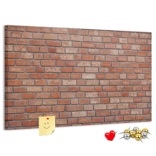 Prikbord met print van een bakstenen muur in warme tinten