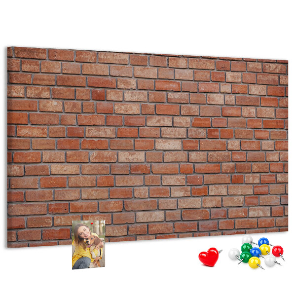 Prikbord met print van een bakstenen muur in warme tinten