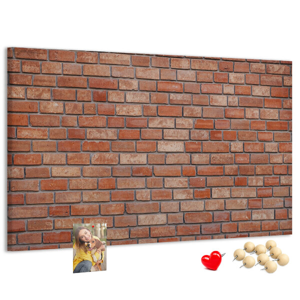 Prikbord met print van een bakstenen muur in warme tinten
