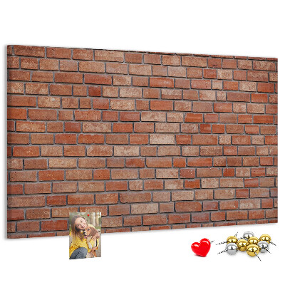 Prikbord met print van een bakstenen muur in warme tinten
