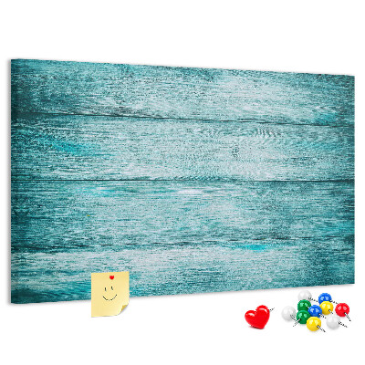 Kurkbord met achtergrond van groene en blauwe houten planken