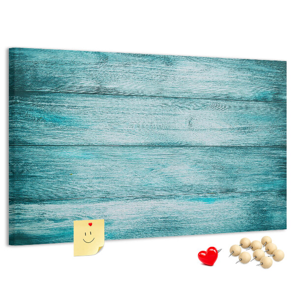 Kurkbord met achtergrond van groene en blauwe houten planken