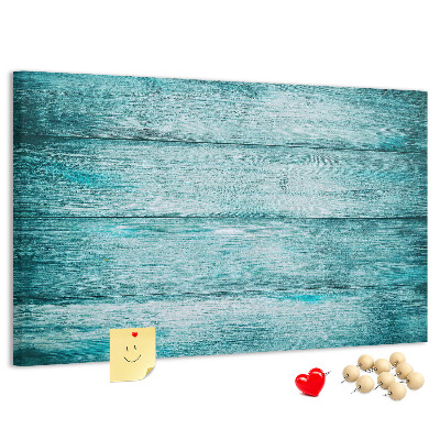 Kurkbord met achtergrond van groene en blauwe houten planken