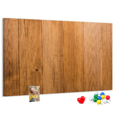 Prikbord van hout met gekleurde pinnen