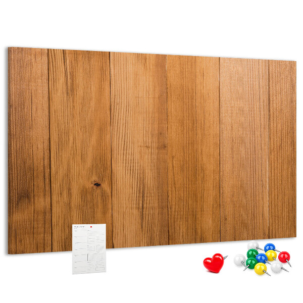 Prikbord van hout met gekleurde pinnen