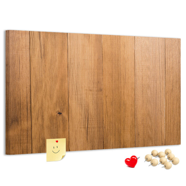 Prikbord van hout met gekleurde pinnen