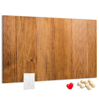 Prikbord van hout met gekleurde pinnen