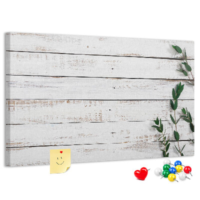 Kurk prikbord met rustiek hout en groene takken
