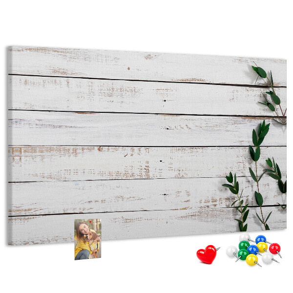 Kurk prikbord met rustiek hout en groene takken