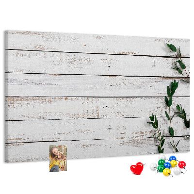 Kurk prikbord met rustiek hout en groene takken