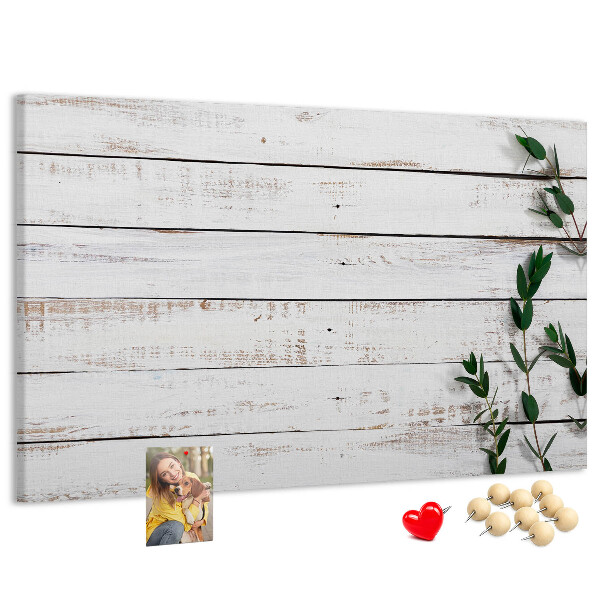 Kurk prikbord met rustiek hout en groene takken