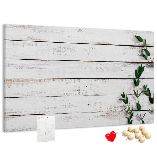 Kurk prikbord met rustiek hout en groene takken