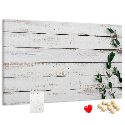 Kurk prikbord met rustiek hout en groene takken