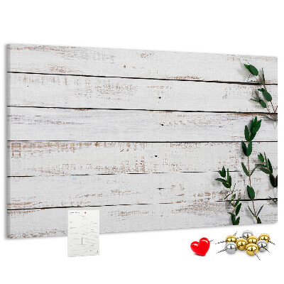 Kurk prikbord met rustiek hout en groene takken