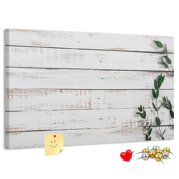 Kurk prikbord met rustiek hout en groene takken
