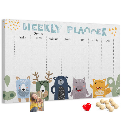 Kurkbord met kleurrijke weekplanner en dierenprint