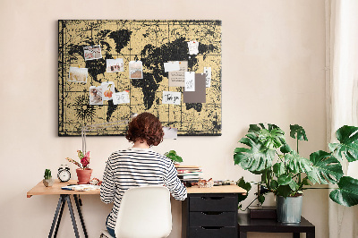 Prikbord met een oude wereldkaart in zwart en goud