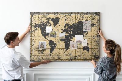 Prikbord met een oude wereldkaart in zwart en goud
