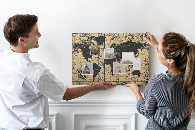 Prikbord met een oude wereldkaart in zwart en goud