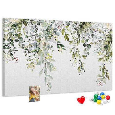 Kurken prikbord met een motief van groene bladeren en tere bloemen