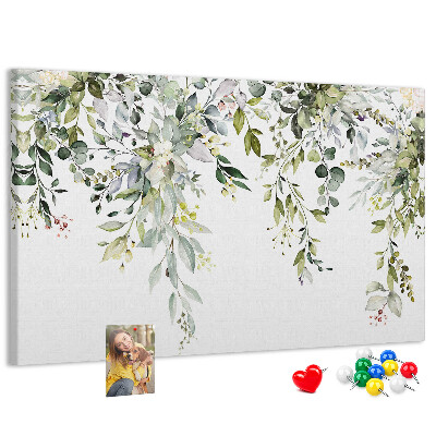 Kurken prikbord met een motief van groene bladeren en tere bloemen