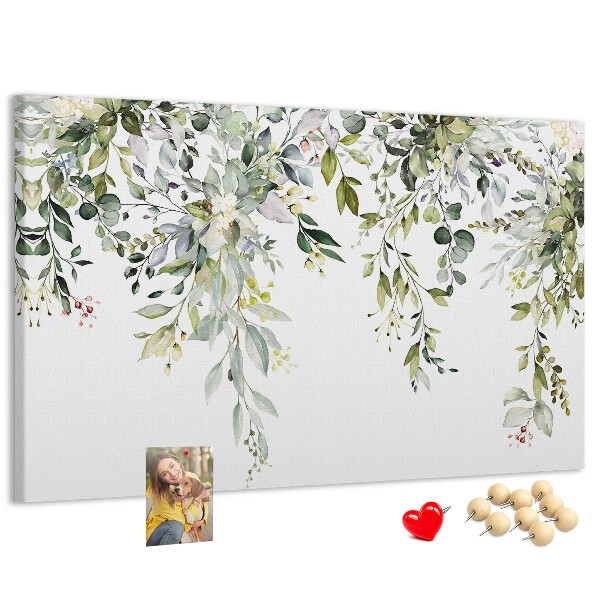 Kurken prikbord met een motief van groene bladeren en tere bloemen