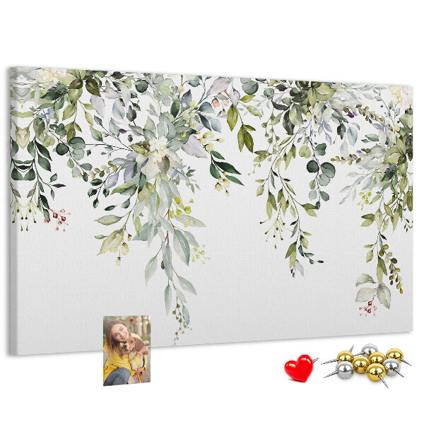Kurken prikbord met een motief van groene bladeren en tere bloemen