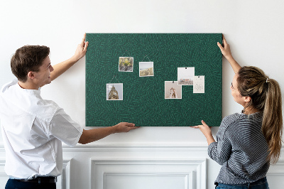 Kurkbord met groene bladeren op een donkere achtergrond