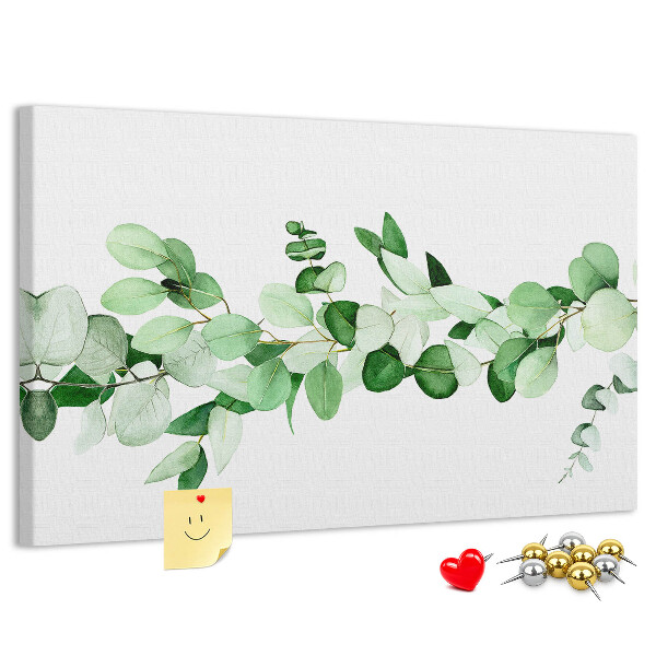 Prikbord met groene bladeren op een lichte achtergrond