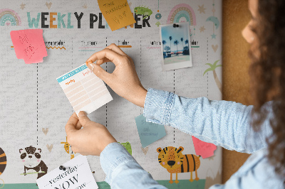 Kurk prikbord met een kleurrijke weekplanner en dierenprint